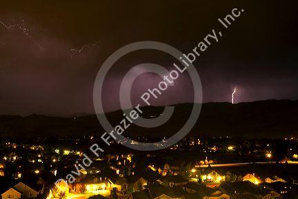 Lightning strikes during a thunderstorm on the first day of summer in Boise, Idaho, USA.