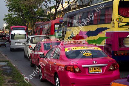 Bus and automobile traffic near the Grand Palace in Bangkok, Thailand.