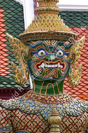 Buddhist mythology yaksa guarding the Temple of the Emerald Buddha located within the precincts of the Grand Palace, Bangkok, Thailand.