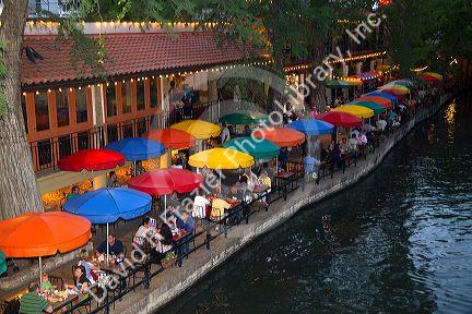 Colorful umbrellas at the Casa Rio restaurant along the River Walk in San Antonio, Texas, USA.