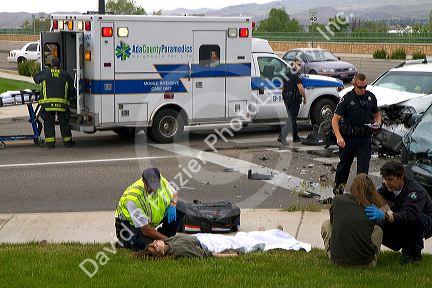 Paramedics and firefighters respond to an automobile injury accident in Boise, Idaho, USA.