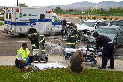 Paramedics and firefighters respond to an automobile injury accident in Boise, Idaho, USA.