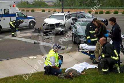 Paramedics and firefighters respond to an automobile injury accident in Boise, Idaho, USA.