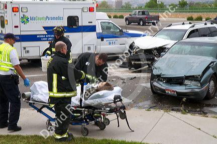 Paramedics and firefighters respond to an automobile injury accident in Boise, Idaho, USA.