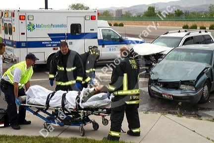 Paramedics and firefighters respond to an automobile injury accident in Boise, Idaho, USA.