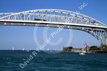 The Blue Water Bridge spanning the St. Clair River connects Port Huron, Michigan with Sarnia, Ontario, Canada.