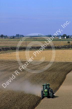 A tractor plows a field in Canyon County, Idaho.