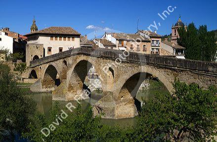 Six-arched Roman bridge spanning the Arga River on the Way of St. James pilgrimage route in Puente La Reina, Navarra, Spain.