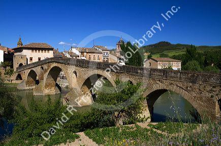 Six-arched Roman bridge spanning the Arga River on the Way of St. James pilgrimage route in Puente La Reina, Navarra, Spain.