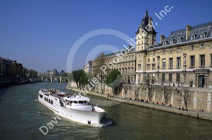 A tour boat on the River Seine passes the Criminal Court in Paris, France.