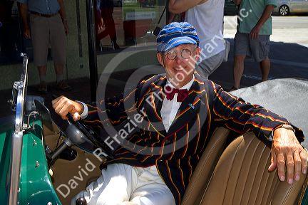 Man sits in his 1930's vintage car during the Tremains Art Deco Weekend  at Napier in the Hawke's Bay Region, North Island, New Zealand.