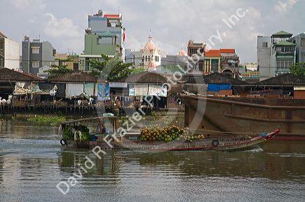 Boats and lifestyle along a canal in Ho Chi Minh City, Vietnam.