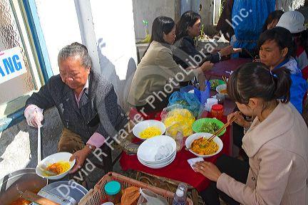 Teachers from the Pedagogical College of Da Lat eating breakfast, Vietnam.