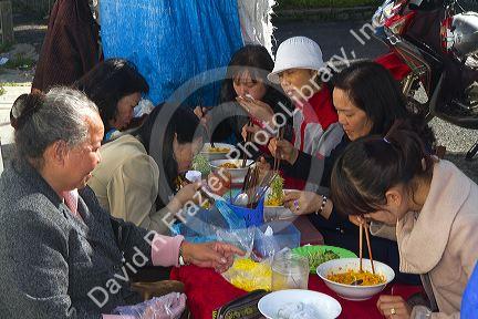 Teachers from the Pedagogical College of Da Lat eating breakfast, Vietnam.