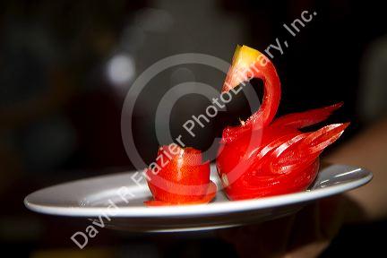 A swan carved out of a tomato on Vietnamese tour boat in Ha Long Bay, Vietnam.