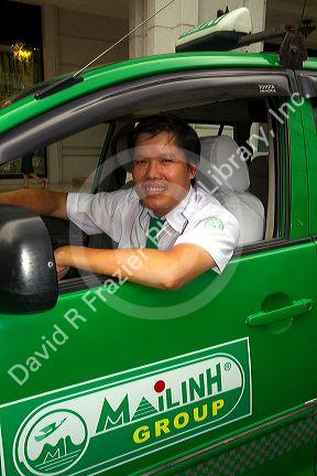 Mai Linh taxi and driver in Ho Chi Minh City, Vietnam.
