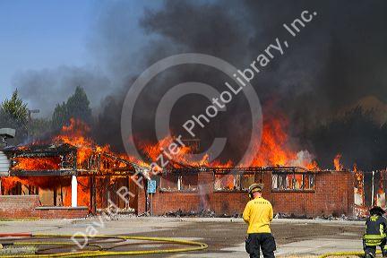 Fire fighters on the scene of a building fire in Boise, Idaho, USA.