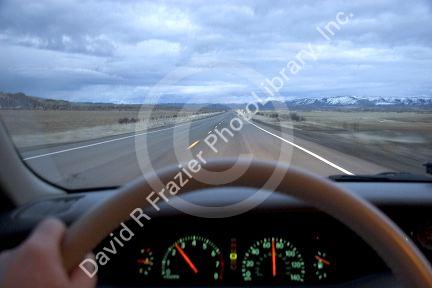 Lonely highway at dusk.  US 95 near McDermitt, Nevada from the driver's perspective.