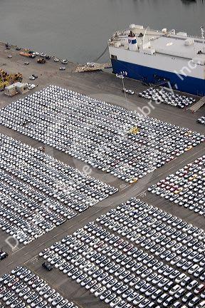 Automobiles being unloaded from a ship at the Port of Long Beach in Los Angeles, California.