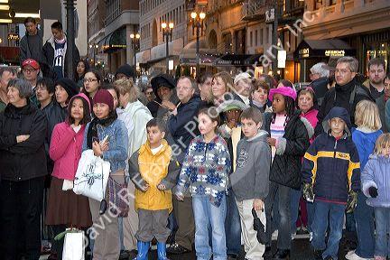 Crowds of people line up along the streets of Chinatown to watch the Chinese New Year Parade, San Francisco, California.