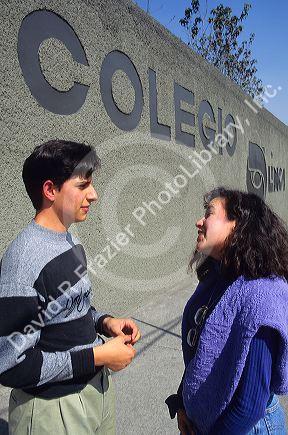 Mexican high school students talking outside school in Mexico City.