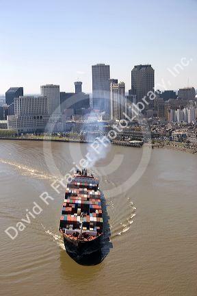Container ship on the Mississippi River departing New Orleans, Louisiana.