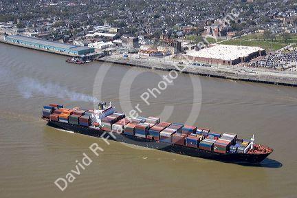 Container ship on the Mississippi River departing New Orleans, Louisiana.