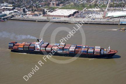 Container ship on the Mississippi River departing New Orleans, Louisiana.