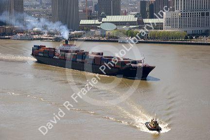 Container ship on the Mississippi River departing New Orleans, Louisiana.