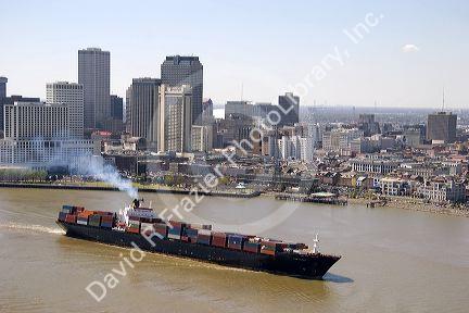 Container ship on the Mississippi River departing New Orleans, Louisiana.