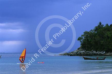 A person wind surfing at Phuket Island, Thailand.