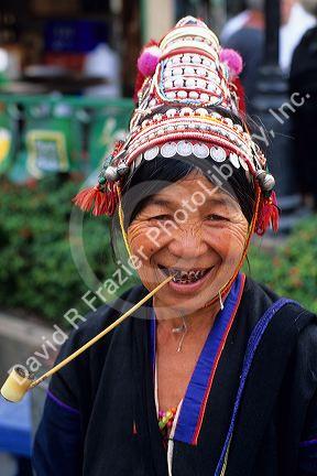 Hill Tribe woman smoking a pipe in Thailand.