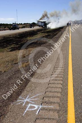 An automobile accident on Interstate 40 east of Moriarty, New Mexico.  Mark on pavement indicates point car left roadway.