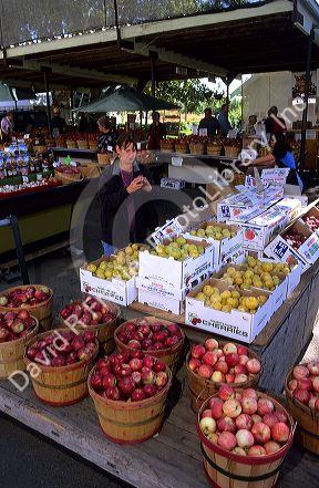 Customers shop at a fruit and vegetable stand in Marsing, Idaho.
