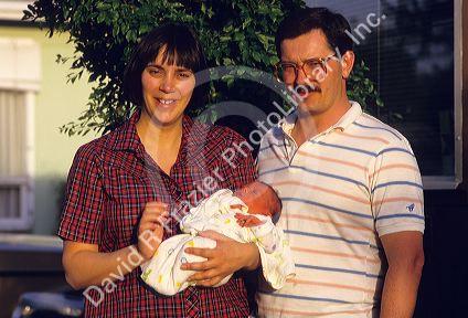 Mother and father with new born baby.