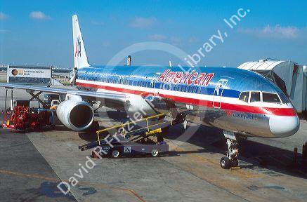 American Airline 757 being serviced by ground equiptment.