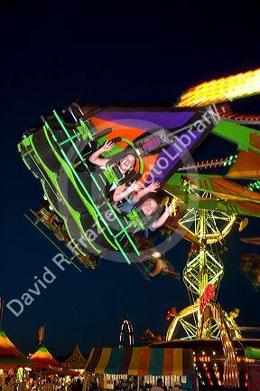 Children on a ride at the Iowa state fair in Des Moines.