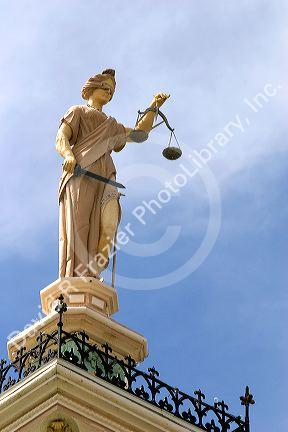 The scales of justice on top of the courthouse in Davis County, Bloomfield, Iowa.