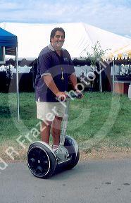 Man rides a segway at the Idaho State Fair.