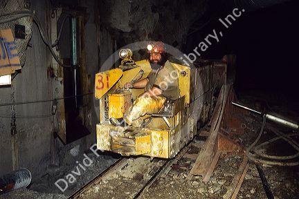 Miner riding a rail car inside the Lucky Friday Silver Mine in Wallace, Idaho.
