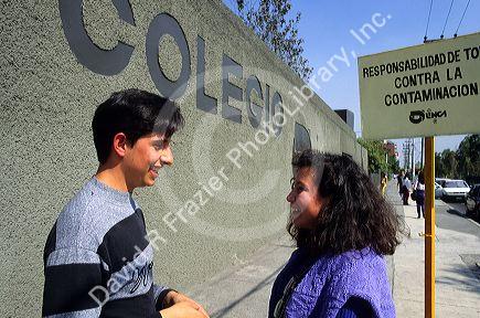 Teenage students talking in front their school in Mexico City, Mexico.