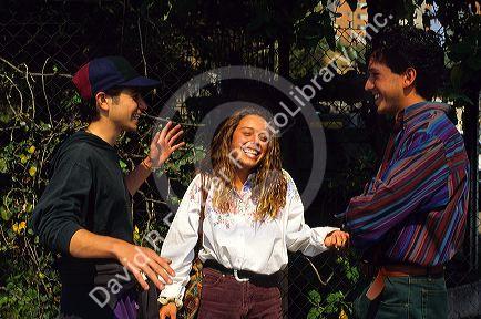 Mexican teens talking and laughing in Mexico.