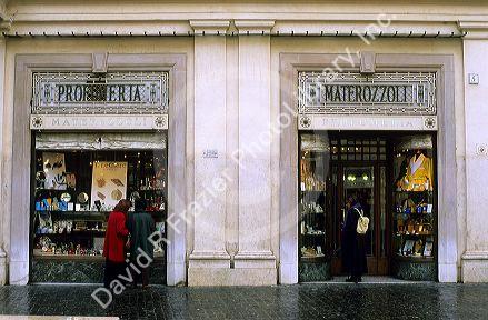 People window shop at a Profumeria in Rome, Italy.