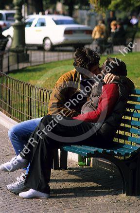 A young Italian couple share a kiss at the Piazza Bra' in Verona, Italy.