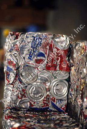 Aluminum cans crushed into blocks for recycling.