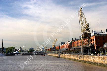 Red brick building and cranes at Puerto Modero in Buenos Aires, Argentina.
