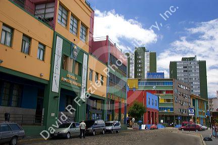 Colorful buildings in the La Boca area of Buenos Aires, Argentina.  Old school at left is an art gallery.