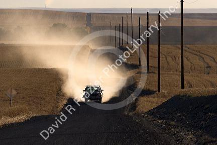 Pick up truck on dusty rural road near Pendleton, Oregon.