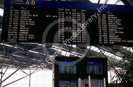 A flight departure board at the airport in Cologne, Germany.