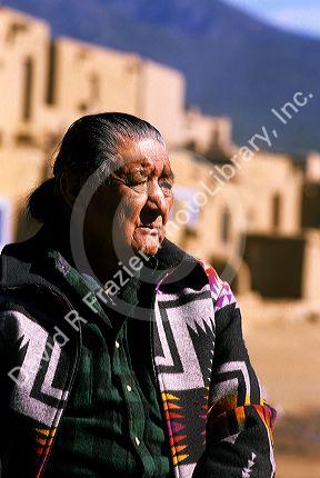 Indian pueblo man and adobe buildings in Taos, New Mexico.